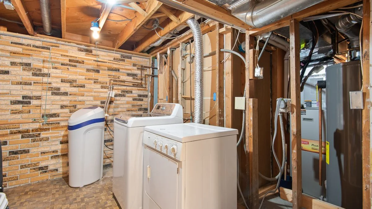 Basement utility room with furnace and water heater